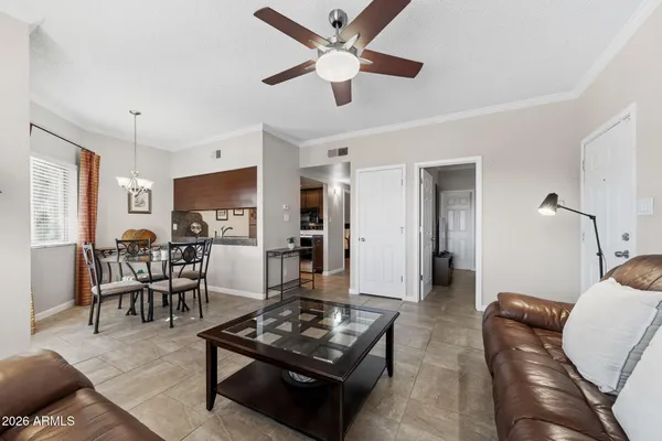 a living room with furniture and a table