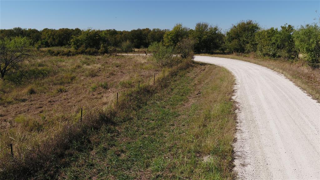 6 County Road Mexia, TX 76667 - Photo 30 of 33 a view of a dry yard with a large tree