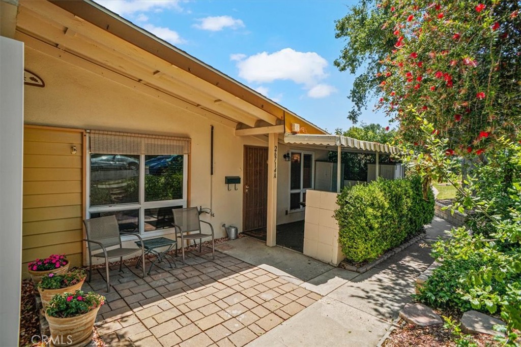 26714 Oak Crossing Road, Unit A Newhall, CA 91321 - Photo 1 of 1 a backyard of a house with outdoor seating