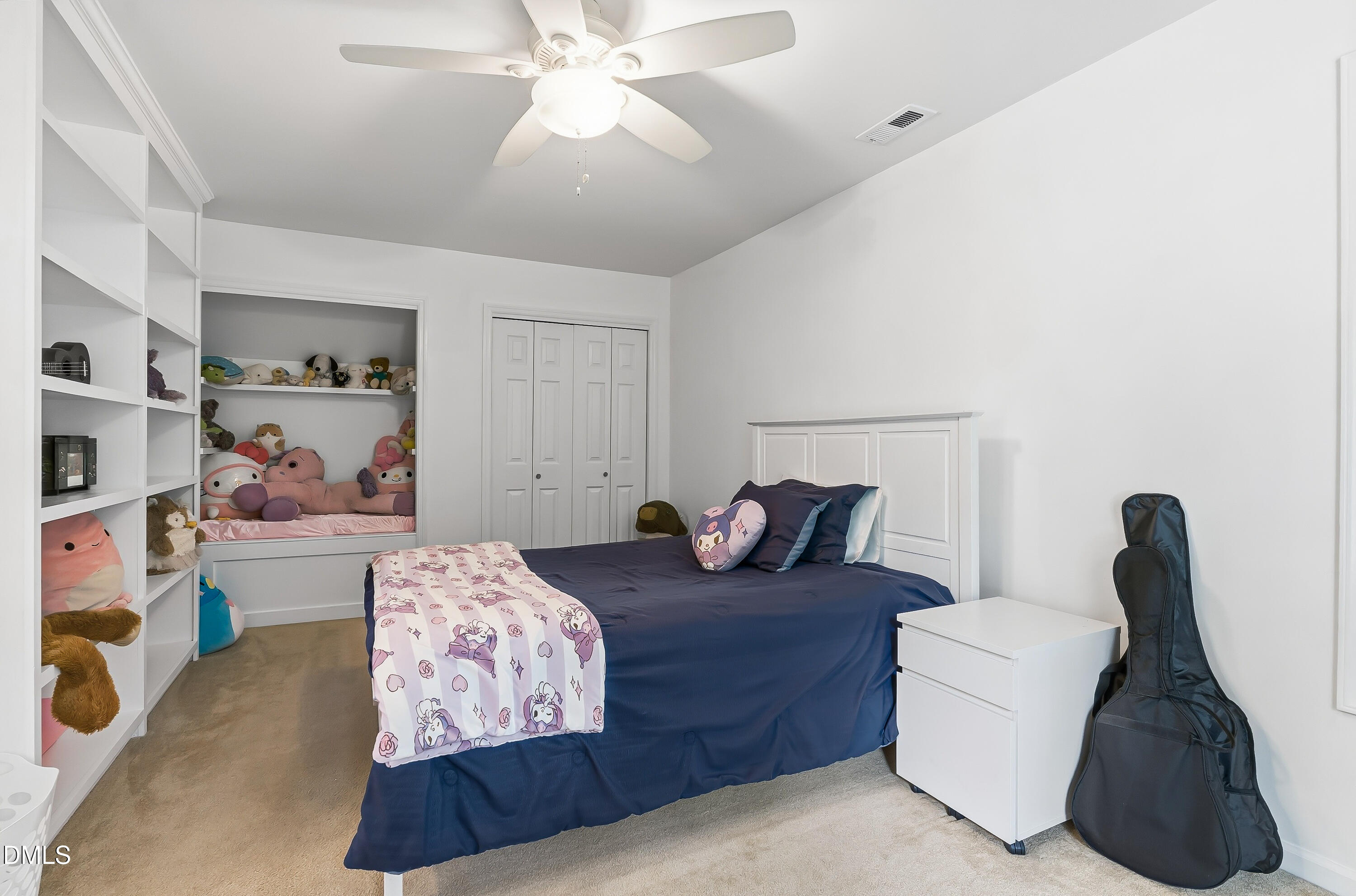 1214 Halcyon Place Rougemont, NC 27572 - Photo 31 of 69 a bedroom with a bed and a chandelier