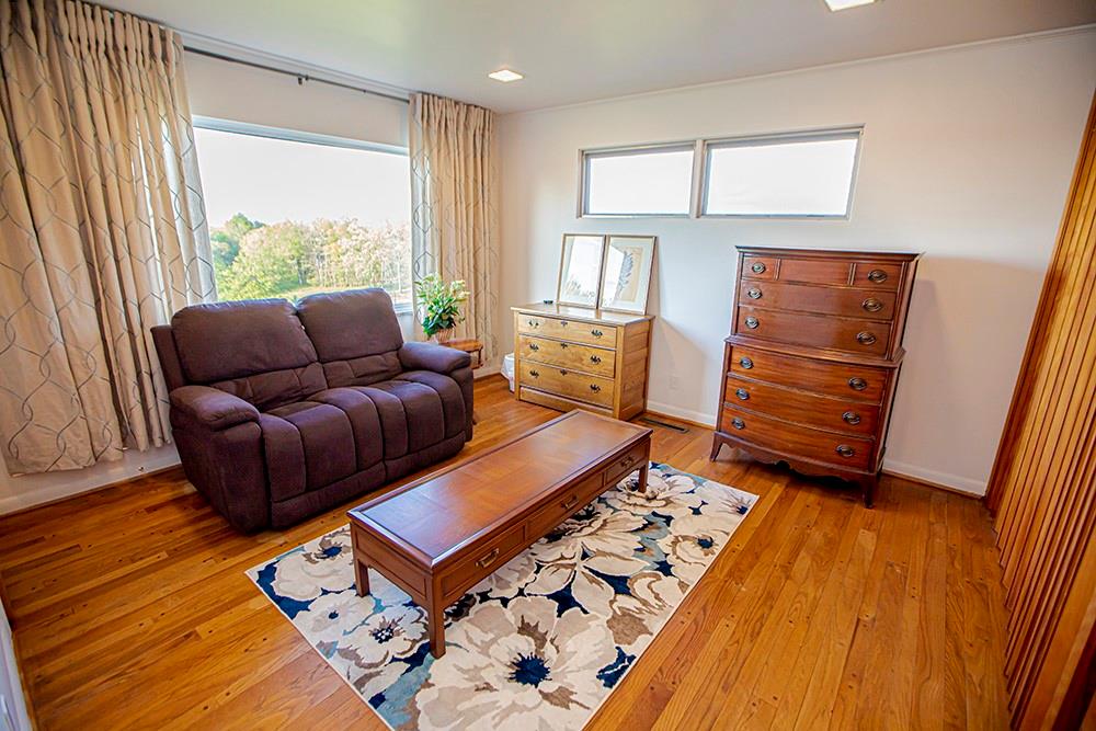 131 East Airport Road Butler, PA 16002 - Photo 17 of 25 a living room with furniture and wooden floor