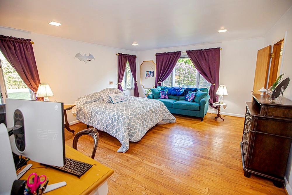 131 East Airport Road Butler, PA 16002 - Photo 18 of 25 a bedroom with furniture and a wooden floor