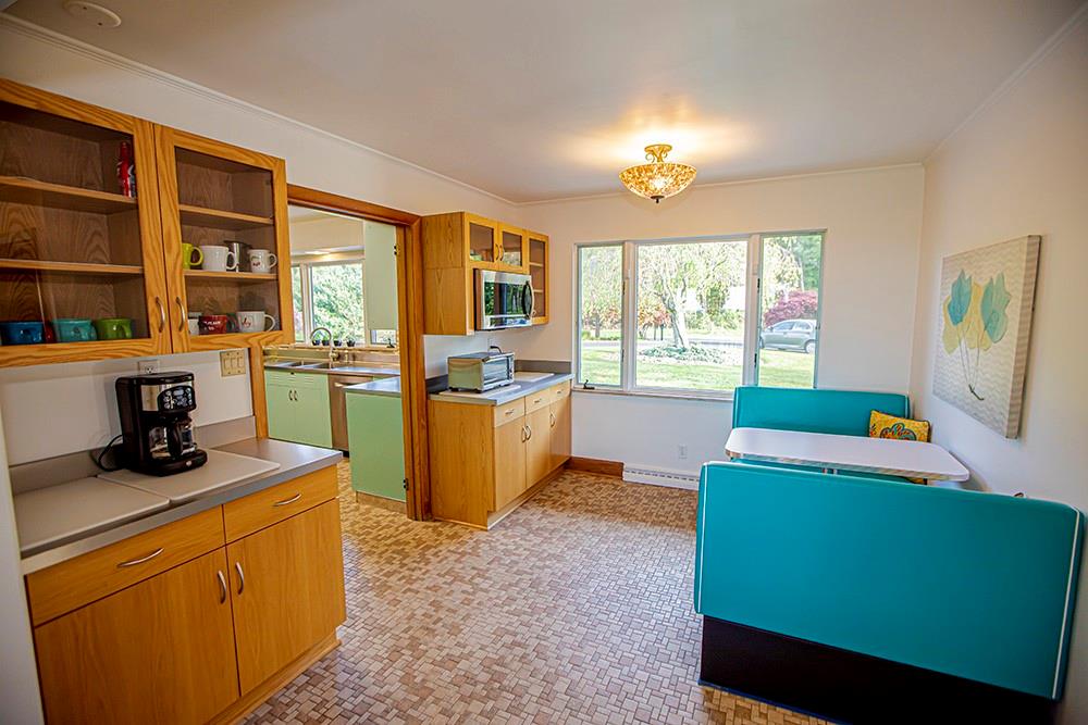 131 East Airport Road Butler, PA 16002 - Photo 7 of 25 a kitchen with cabinets a refrigerator and a dining table
