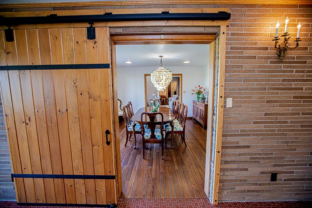 131 East Airport Road Butler, PA 16002 - Photo 9 of 25 a view of a hallway with wooden floor and staircase