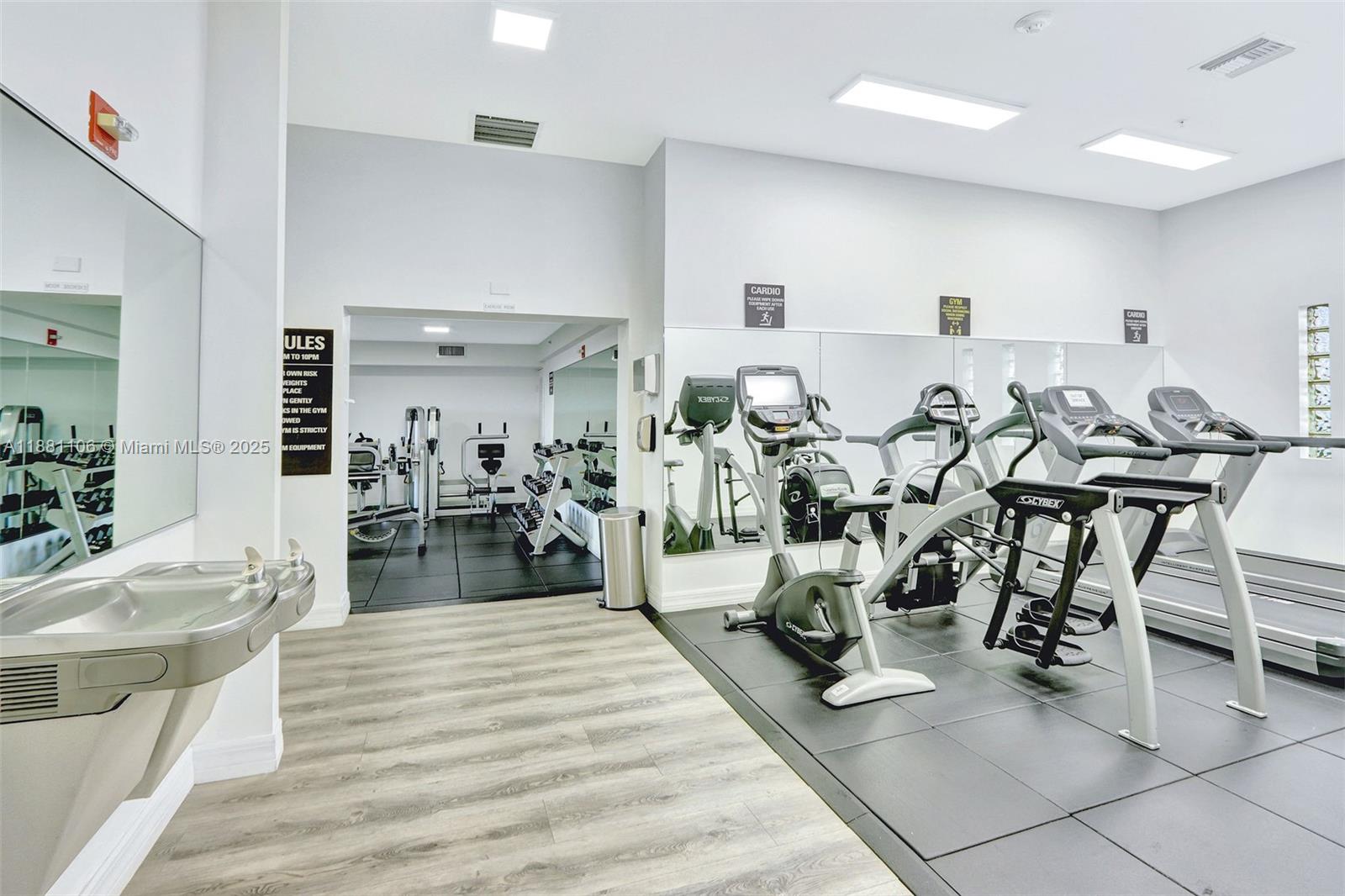 816 Northwest 11th Street, Unit 905 Miami, FL 33136 - Photo 11 of 14 a living room with lots of chairs and appliances