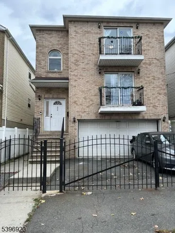a front view of a house with glass windows