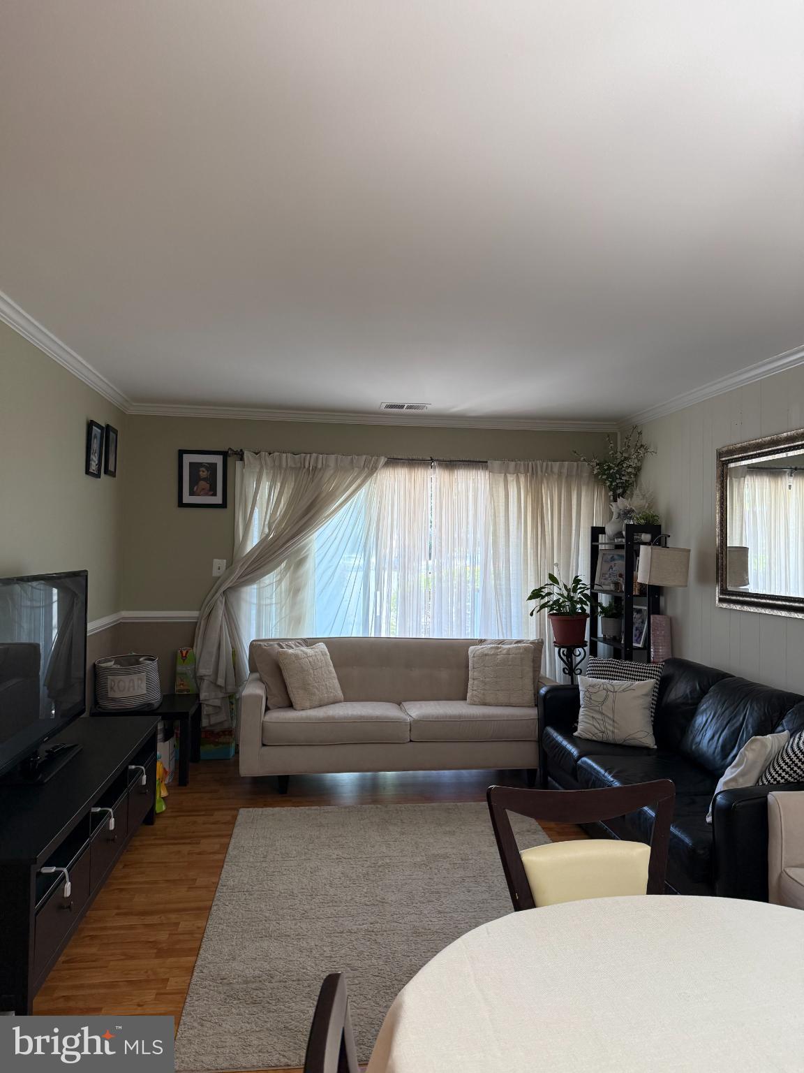 5806 Royal Ridge Drive, Unit B Springfield, VA 22152 - Photo 2 of 4 a living room with furniture and a window