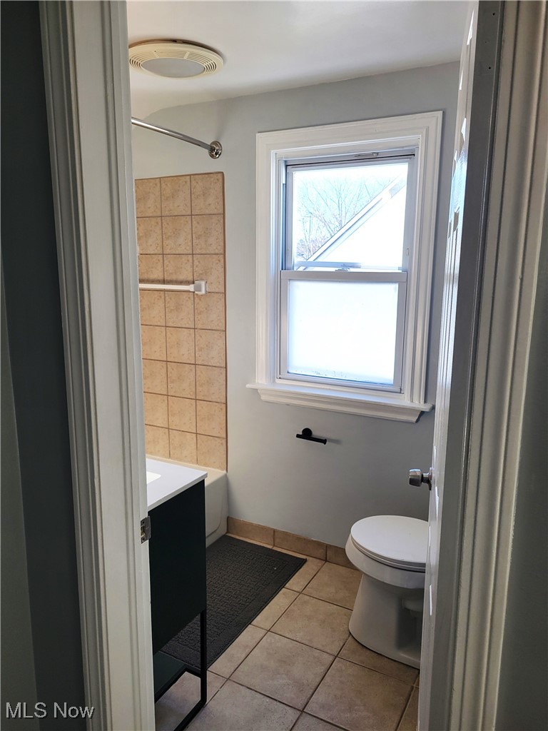 1185 Winston Road Cleveland, OH 44121 - Photo 20 of 24 Bathroom featuring vanity, toilet, and tile patterned flooring