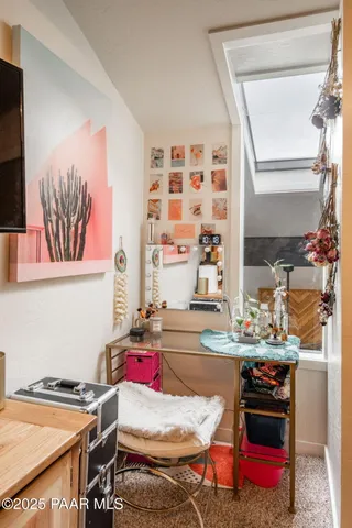 a room with furniture and next to a window