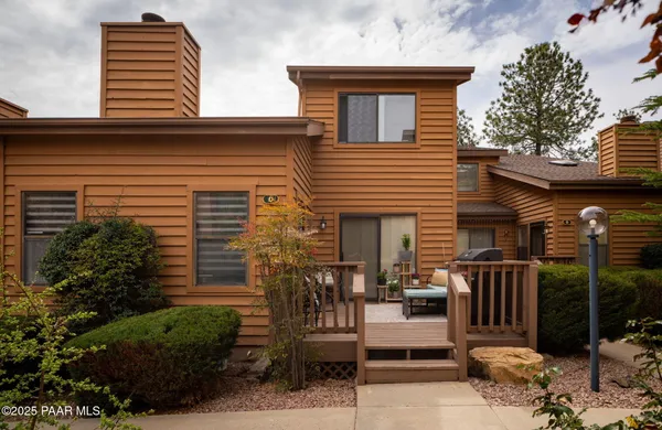 front view of a house with a chair
