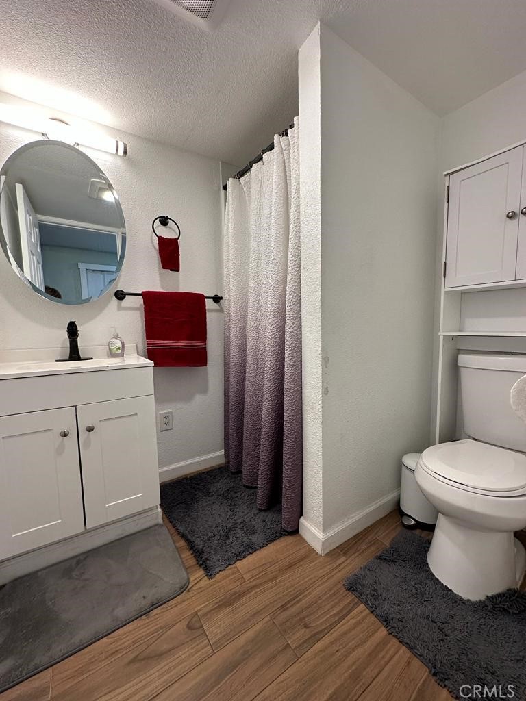 5751 Bridgehead Road, Unit 38 Oakley, CA 94561 - Photo 11 of 17 a bathroom with a toilet sink and mirror