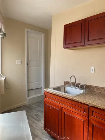 a kitchen with stainless steel appliances granite countertop a sink and cabinets