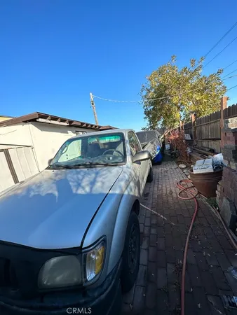 a view of a balcony with chair and table