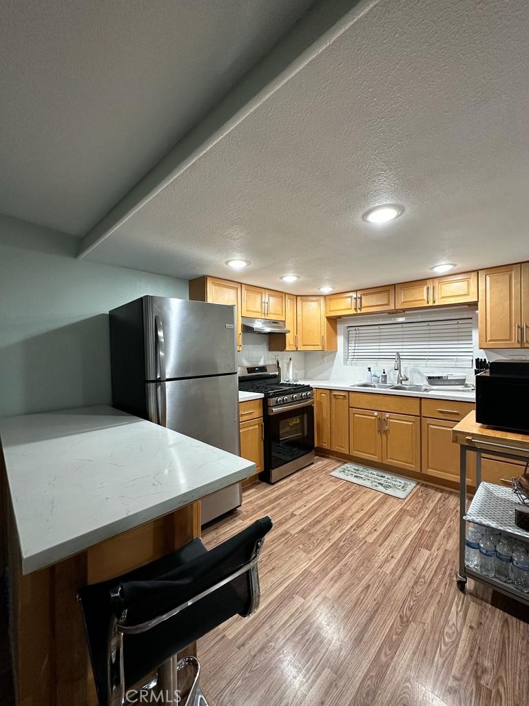 5751 Bridgehead Road, Unit 38 Oakley, CA 94561 - Photo 7 of 17 a kitchen with a refrigerator and a stove top oven