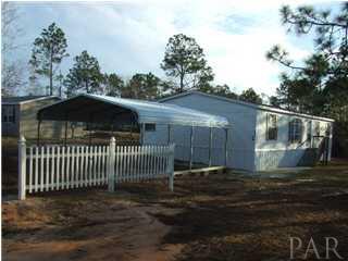2154 Crescent Wood Road Navarre, FL 32566 - Photo 1 of 3 Great mobile home - 4 bedrooms = looks brand new. New carport just put in.