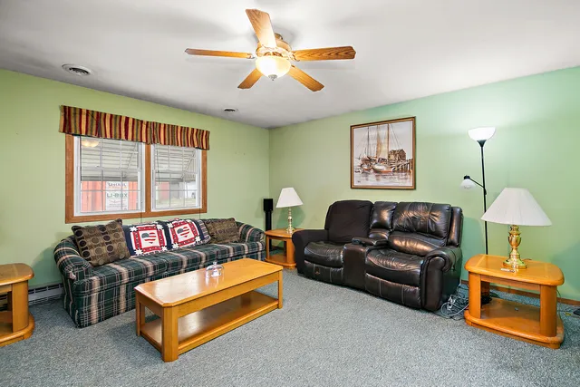a living room with furniture and a window