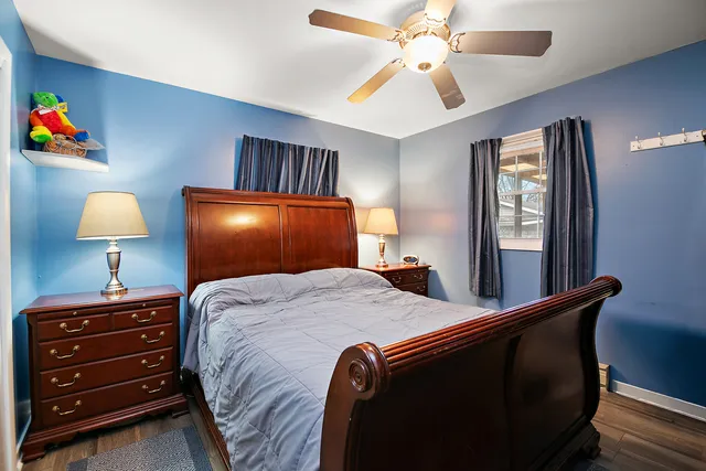 a bed room with a bed and a lamp