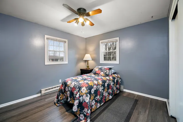 a bedroom with bed and a window