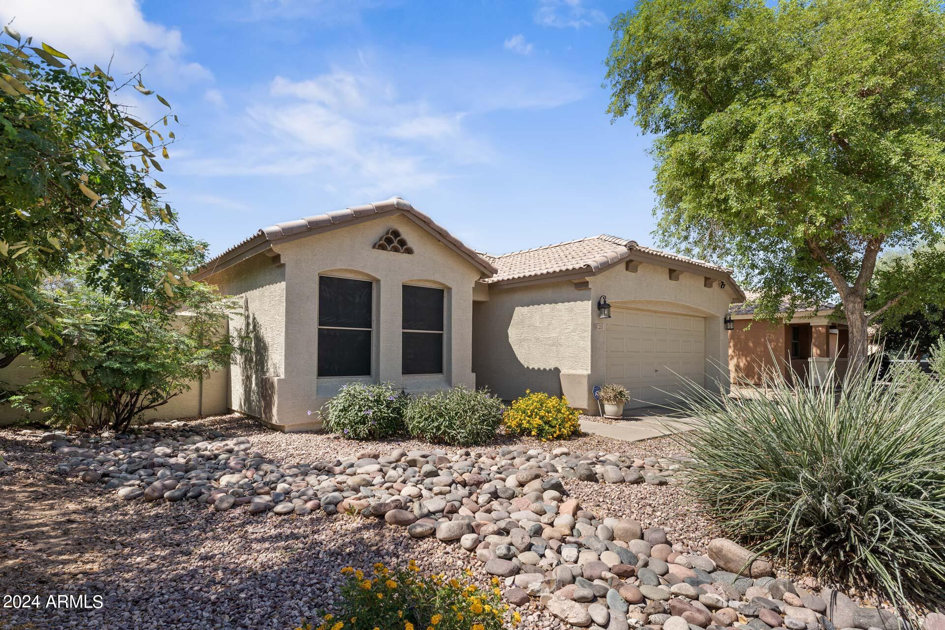 2331 West Apollo Road Phoenix, AZ 85041 - Photo 3 of 26 a front view of a house with garden