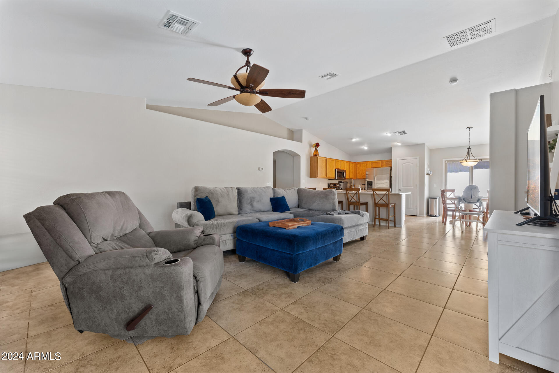 2331 West Apollo Road Phoenix, AZ 85041 - Photo 8 of 26 a living room with furniture and kitchen view