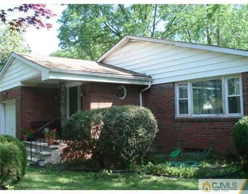 2031 Oak Tree Road Edison, NJ 08820 - Photo 11 of 12 a front view of a house with garden