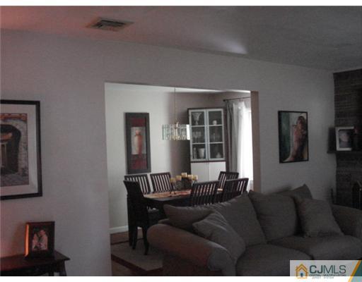 2031 Oak Tree Road Edison, NJ 08820 - Photo 4 of 12 a living room with furniture and a window