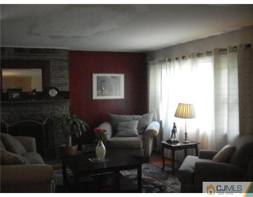 2031 Oak Tree Road Edison, NJ 08820 - Photo 5 of 12 a living room with furniture and a window