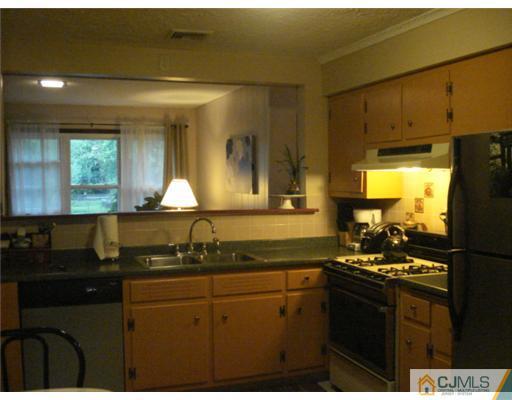 2031 Oak Tree Road Edison, NJ 08820 - Photo 6 of 12 a kitchen with sink and cabinets