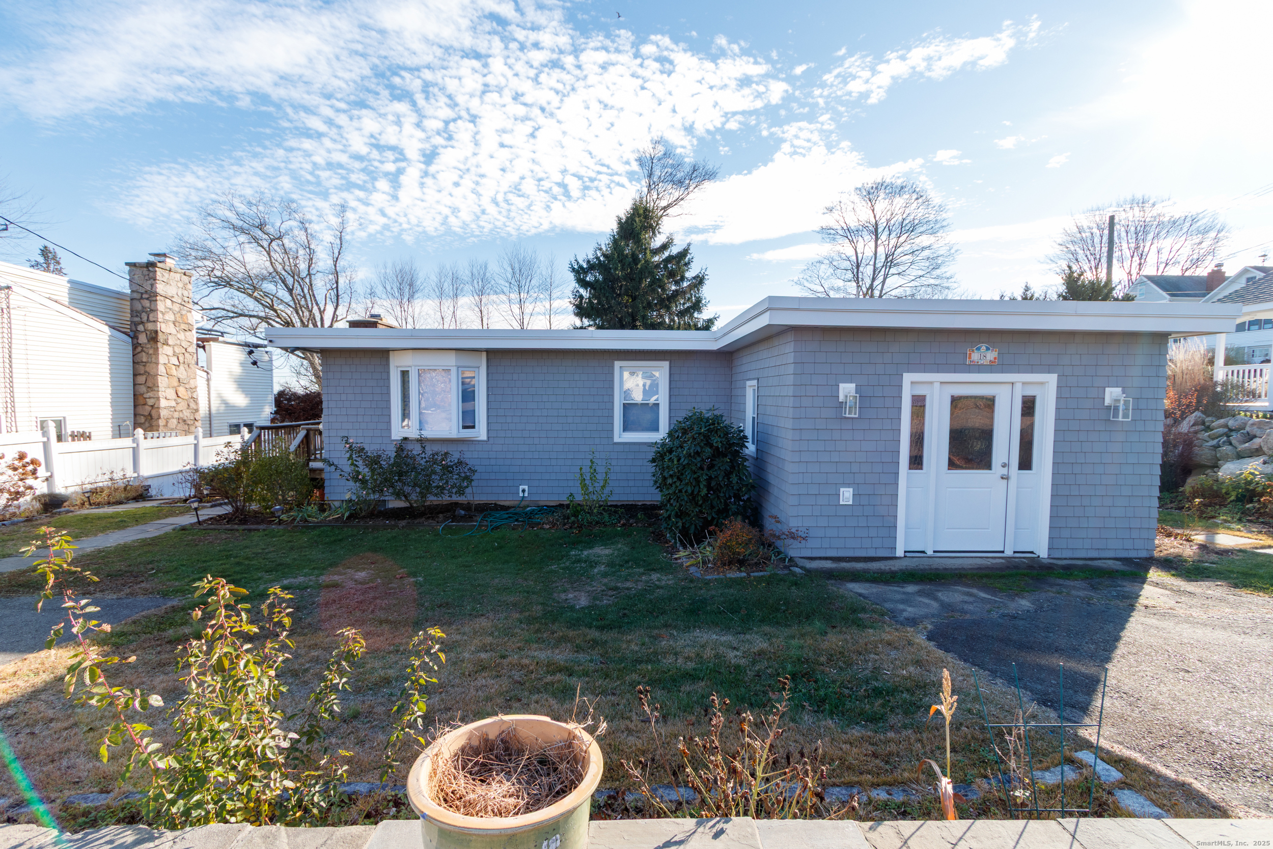 a view of a house with a yard and plants