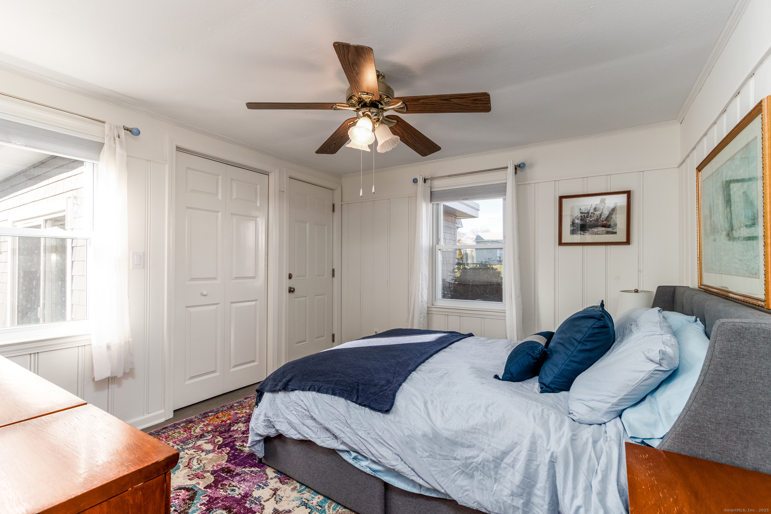 18 Bay Street Guilford, CT 06437 - Photo 19 of 34 a bedroom with a bed and window