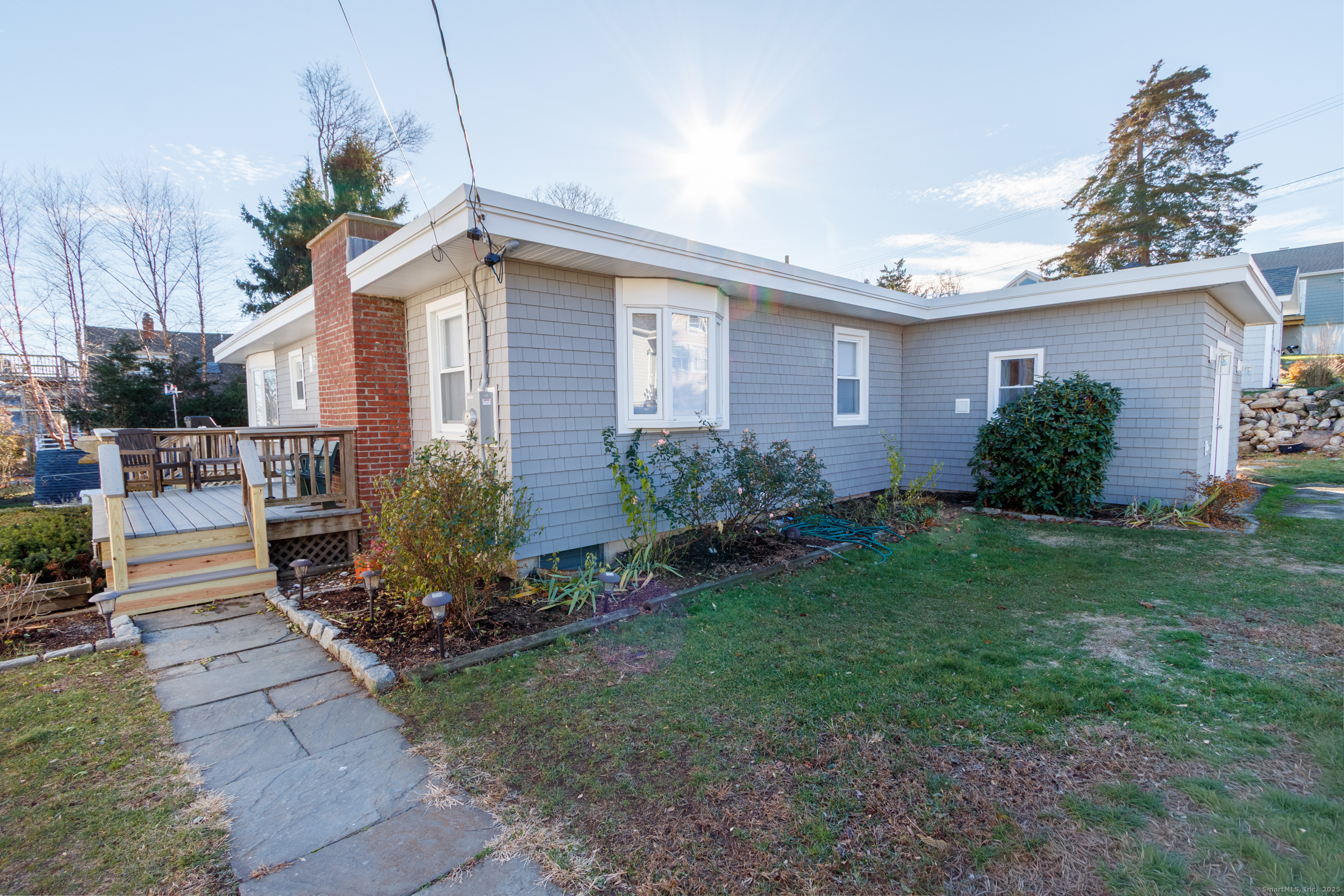 18 Bay Street Guilford, CT 06437 - Photo 2 of 34 a view of a house with garden and yard