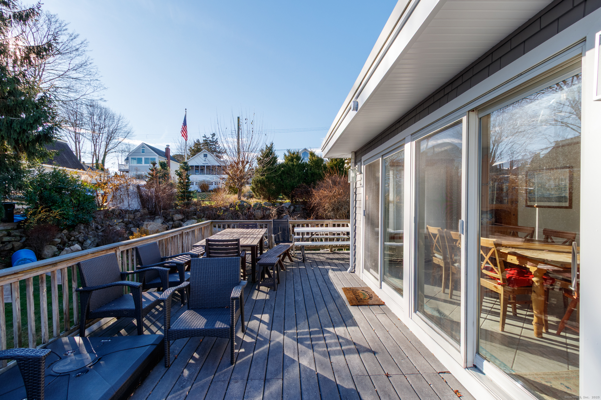 18 Bay Street Guilford, CT 06437 - Photo 26 of 34 a view of balcony with chairs and wooden fence