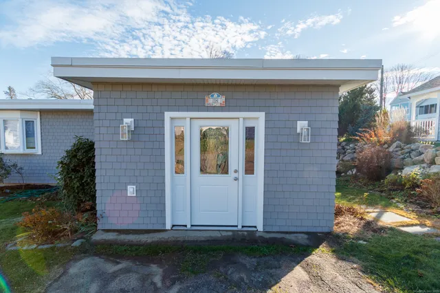a front view of a house with garden