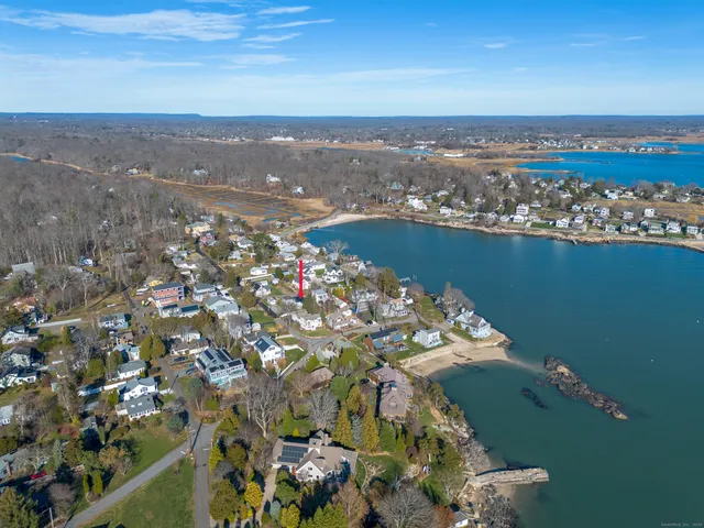 an aerial view of a house with a lake view