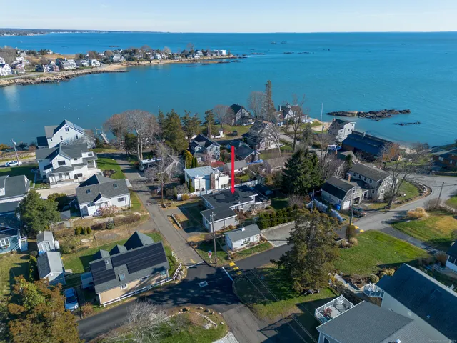 an aerial view of a houses with outdoor space