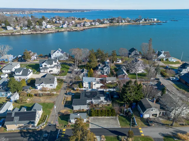 an aerial view of a houses with outdoor space
