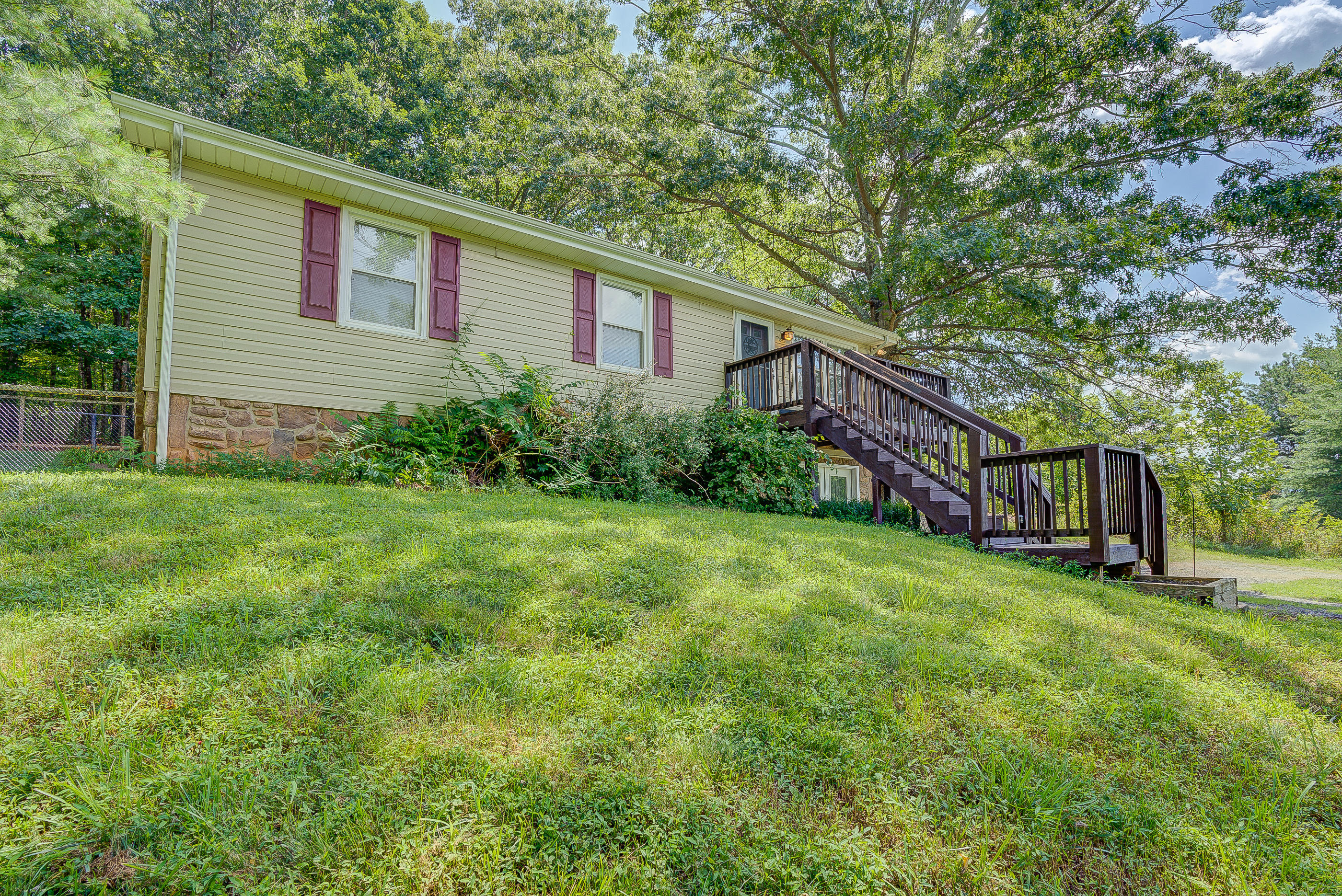 1405 Bore Auger Road Blue Ridge, VA 24064 - Photo 1 of 22 a view of a house with backyard and garden