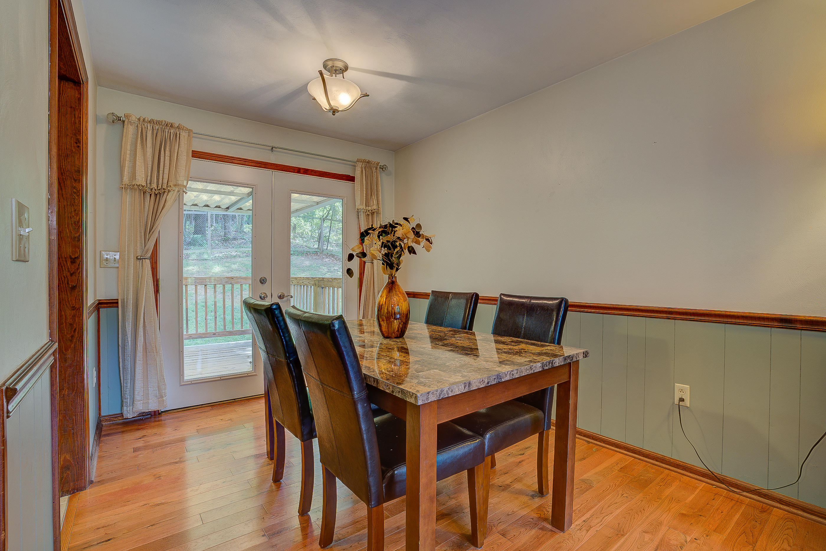 1405 Bore Auger Road Blue Ridge, VA 24064 - Photo 12 of 22 a view of a dining room with furniture window and wooden floor