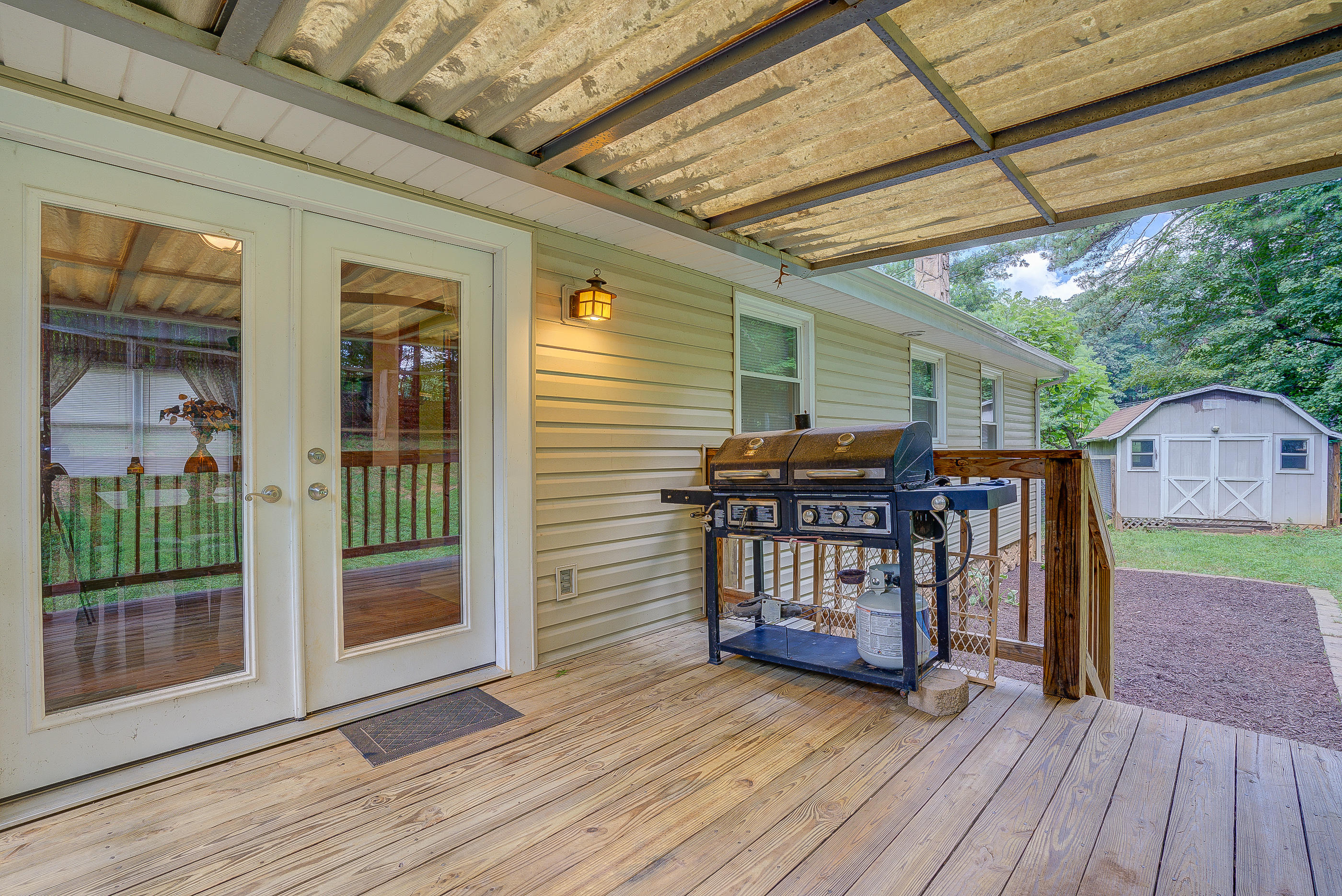 1405 Bore Auger Road Blue Ridge, VA 24064 - Photo 22 of 22 a view of a porch with wooden floor