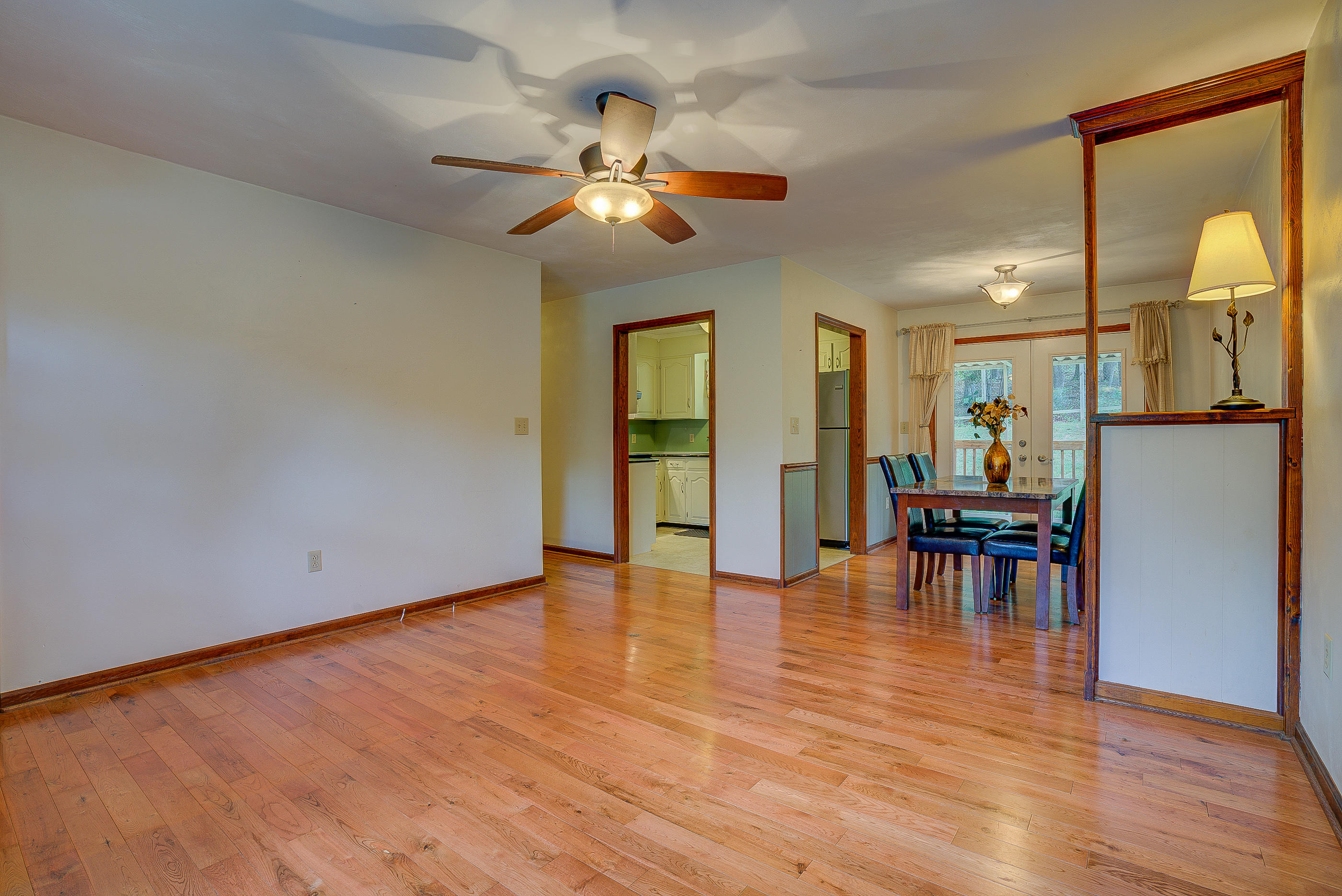 1405 Bore Auger Road Blue Ridge, VA 24064 - Photo 8 of 22 a view of empty room with wooden floor and fan