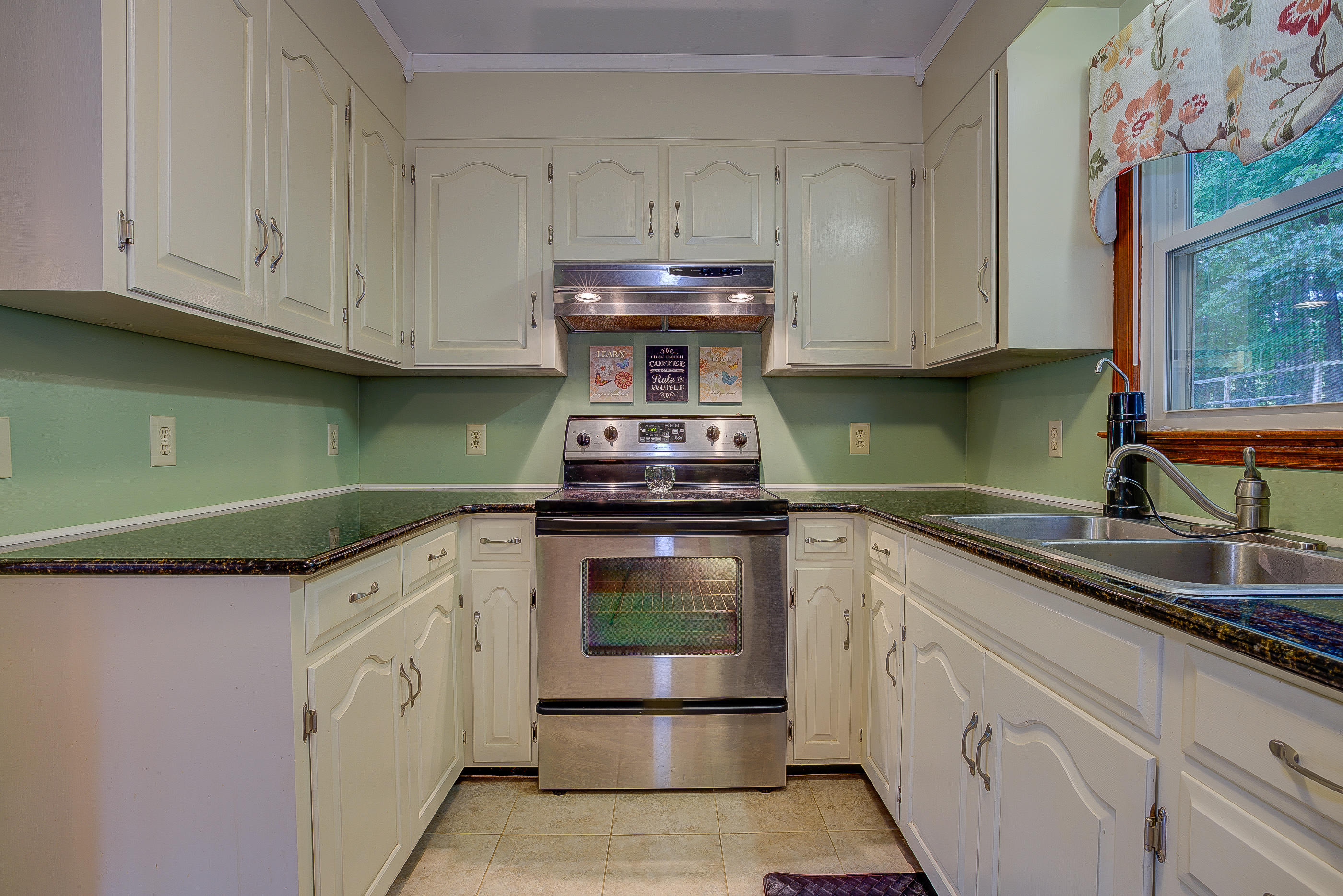 1405 Bore Auger Road Blue Ridge, VA 24064 - Photo 10 of 22 a kitchen with granite countertop a sink and cabinets