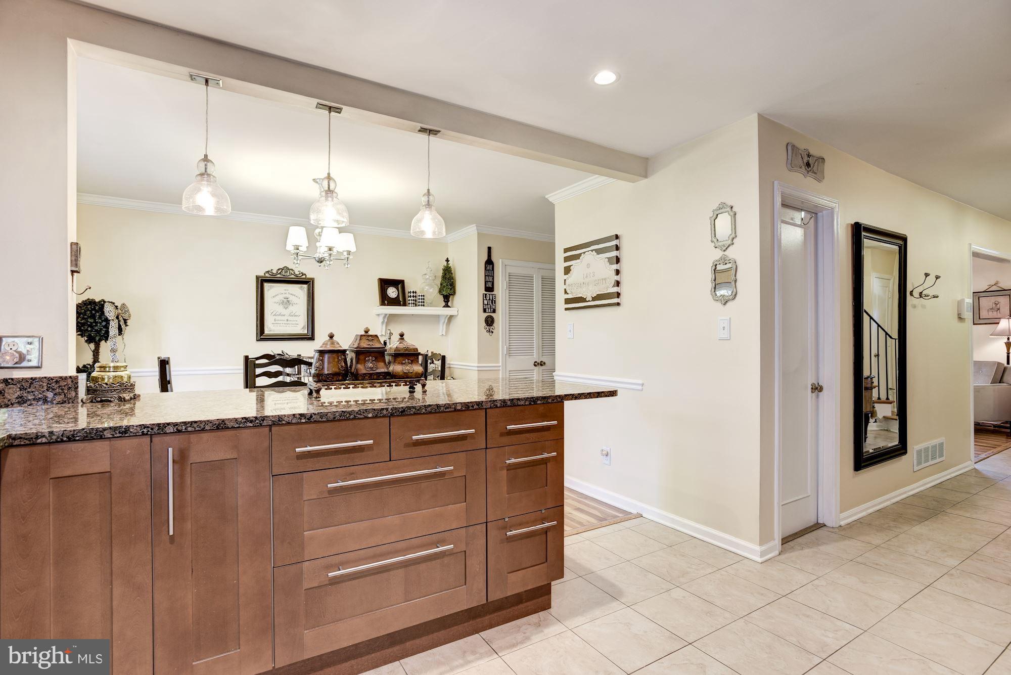 1851 Wainwright Drive Reston, VA 20190 - Photo 11 of 26 a large kitchen with a lot of counter space and wooden floor