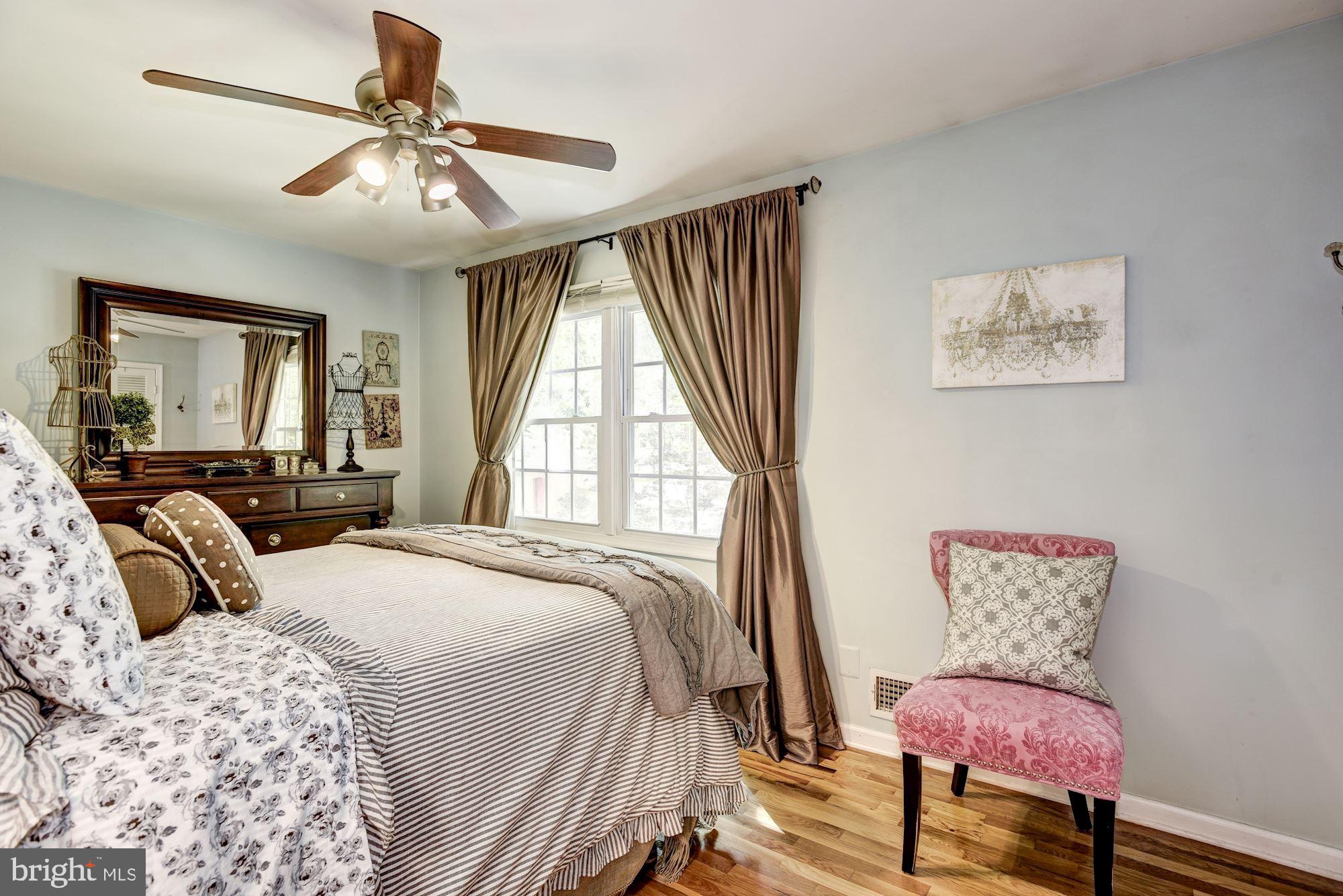 1851 Wainwright Drive Reston, VA 20190 - Photo 13 of 26 a bedroom with a bed and wooden floor