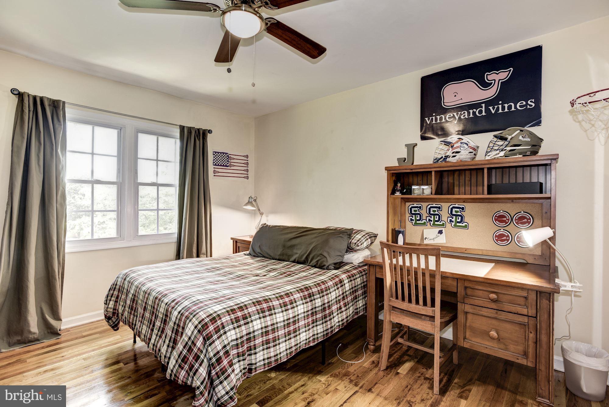 1851 Wainwright Drive Reston, VA 20190 - Photo 16 of 26 a bedroom with a bed dresser and a window