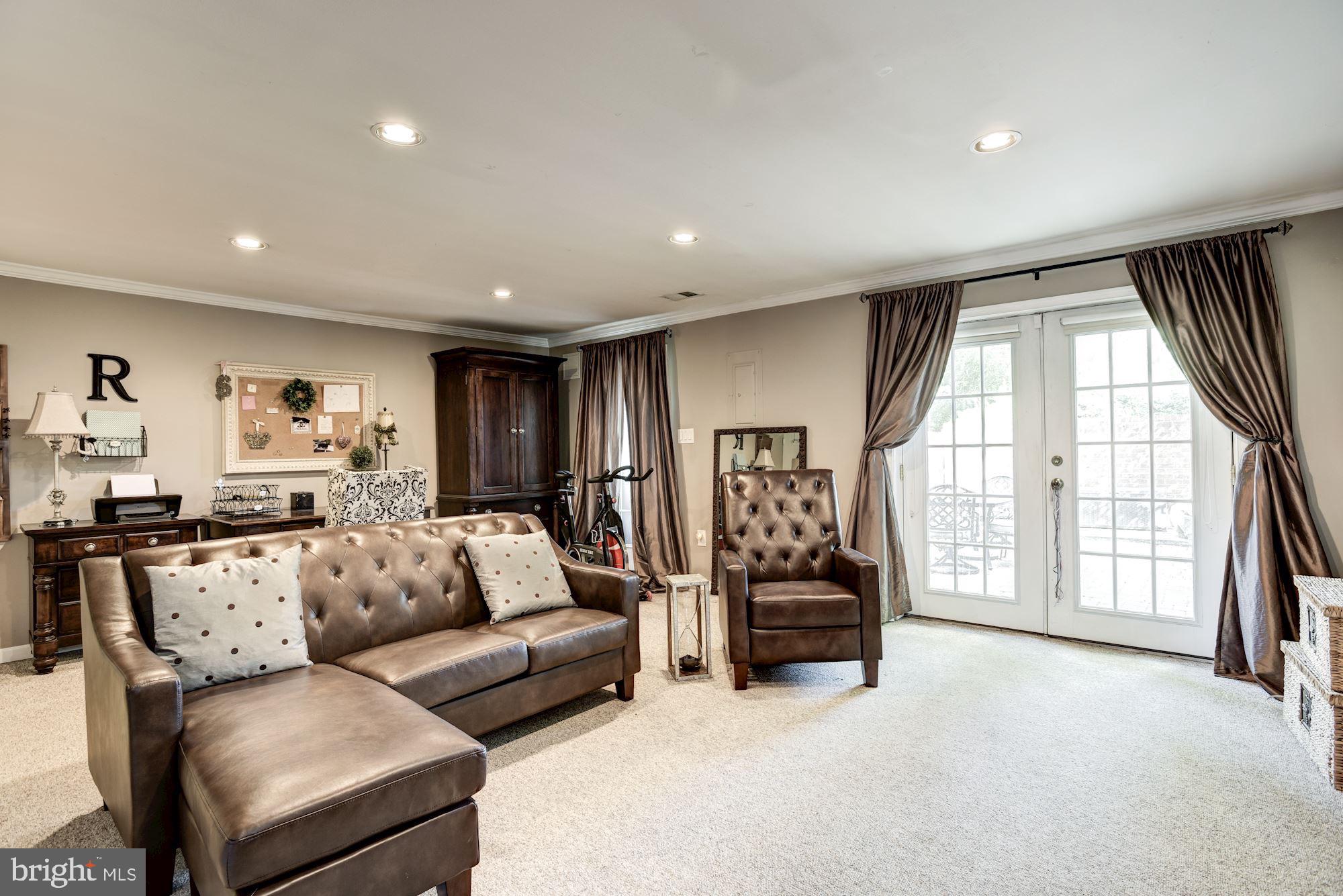 1851 Wainwright Drive Reston, VA 20190 - Photo 20 of 26 a living room with furniture and a large window