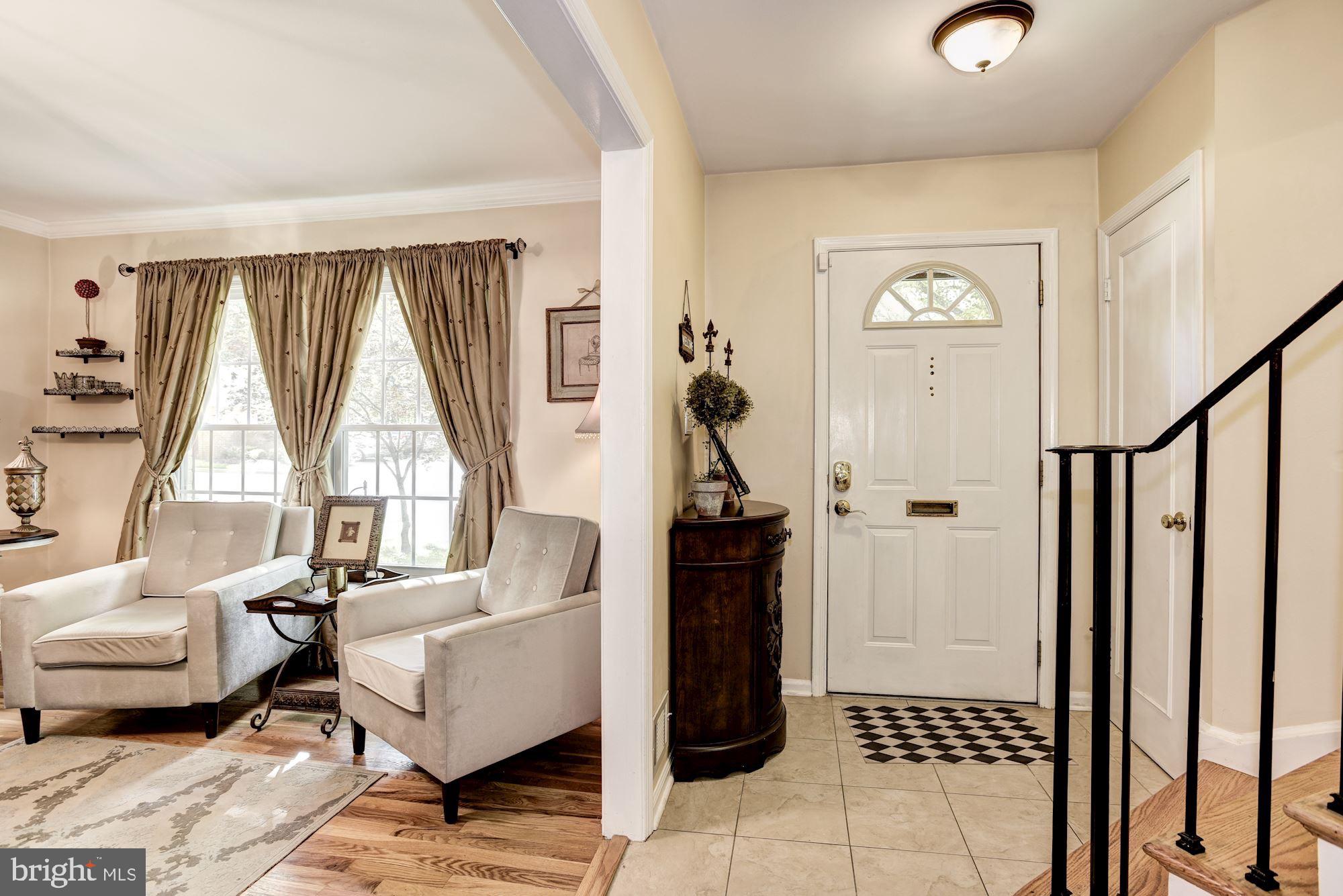 1851 Wainwright Drive Reston, VA 20190 - Photo 2 of 26 a living room with furniture and a window