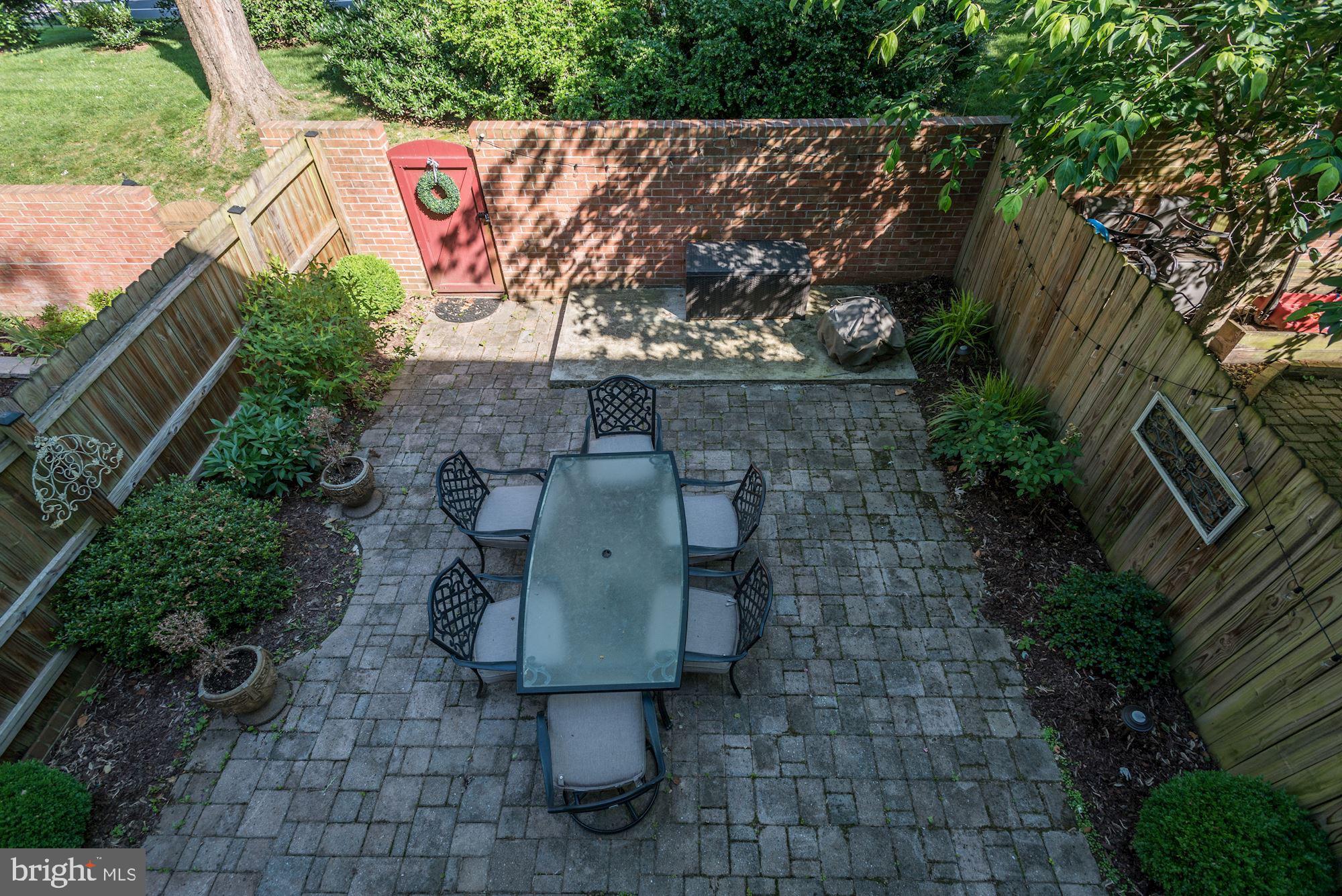 1851 Wainwright Drive Reston, VA 20190 - Photo 23 of 26 a wooden bench sitting in backside of a house