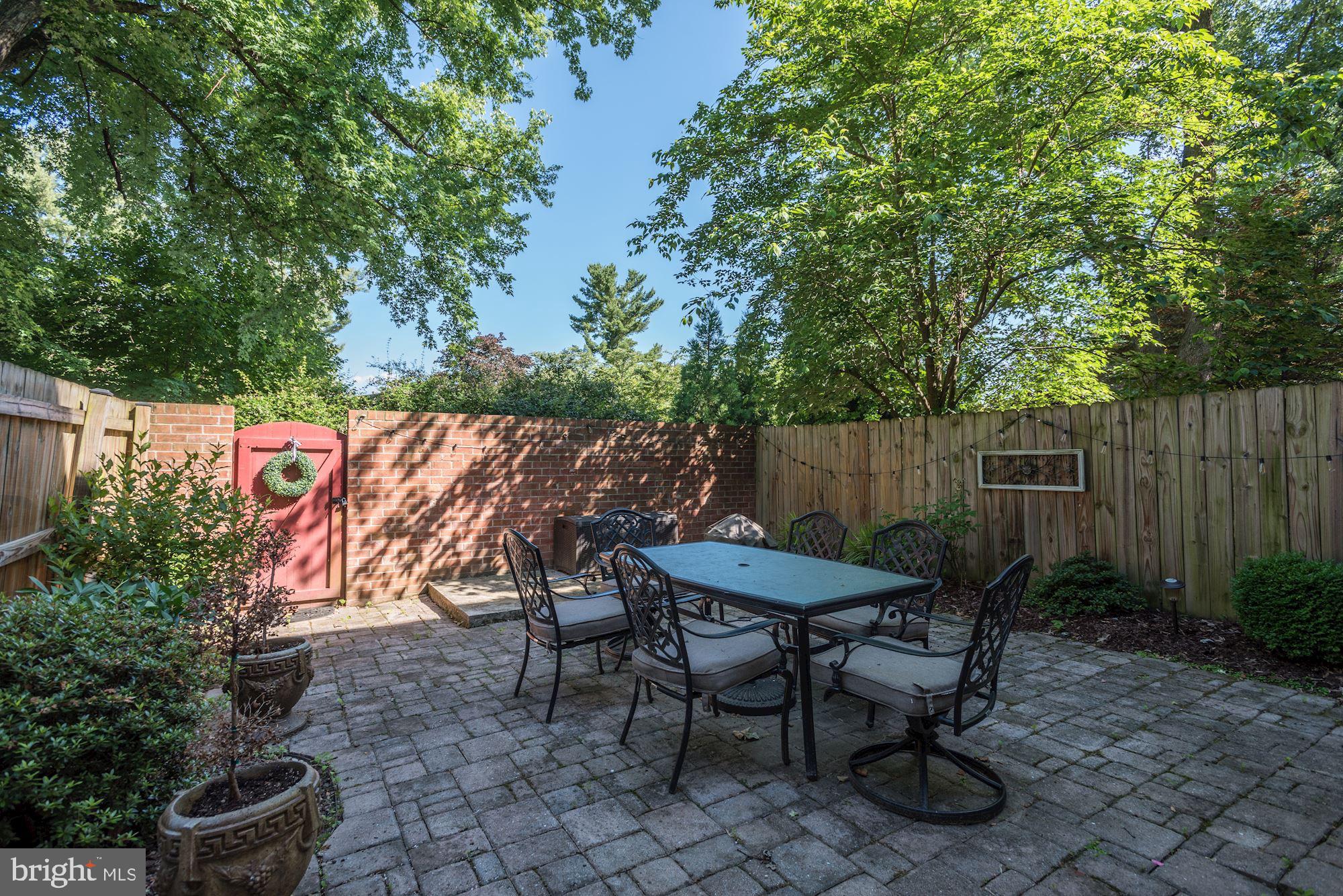 1851 Wainwright Drive Reston, VA 20190 - Photo 24 of 26 a backyard of a house with table and chairs