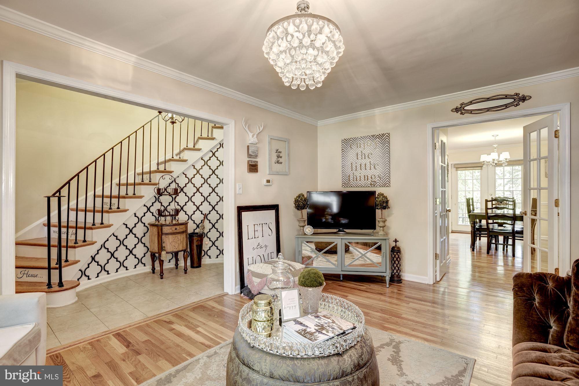 1851 Wainwright Drive Reston, VA 20190 - Photo 4 of 26 a living room with furniture and a flat screen tv