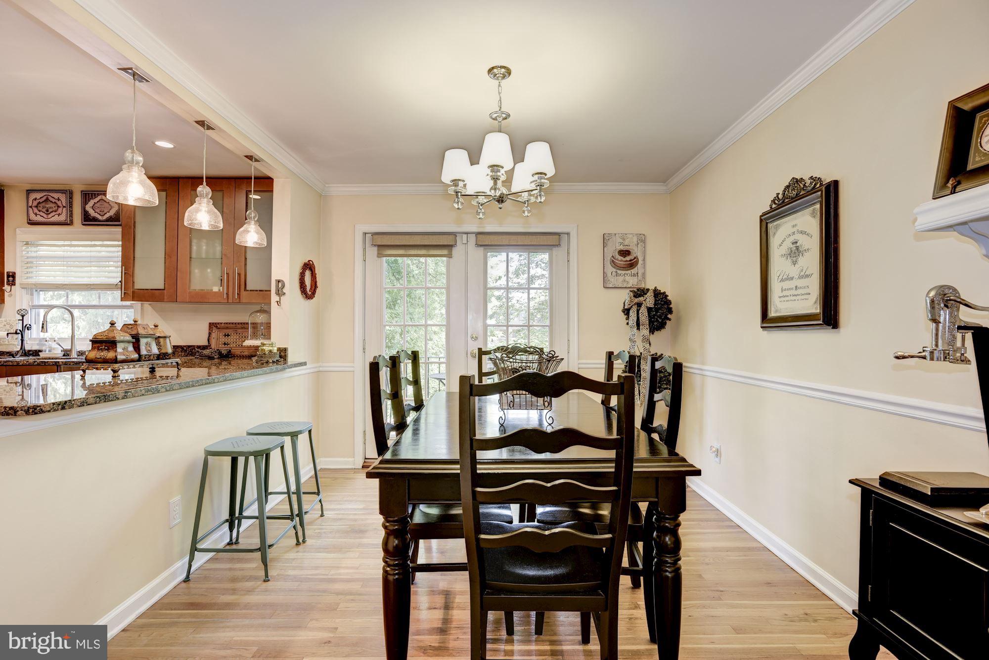 1851 Wainwright Drive Reston, VA 20190 - Photo 6 of 26 a view of a dining room with furniture and wooden floor